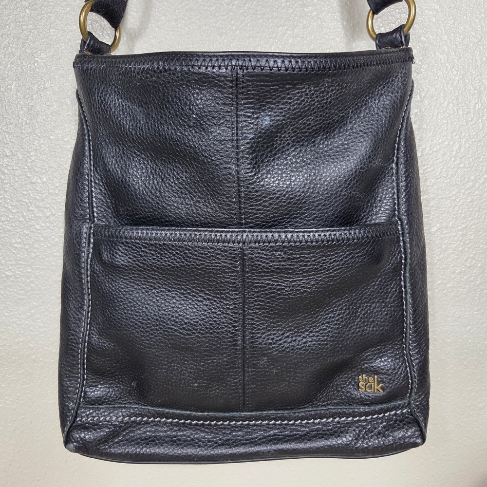 The Sak Black Pebbled Leather Shoulder Bag Front Pocket Brass Hardware